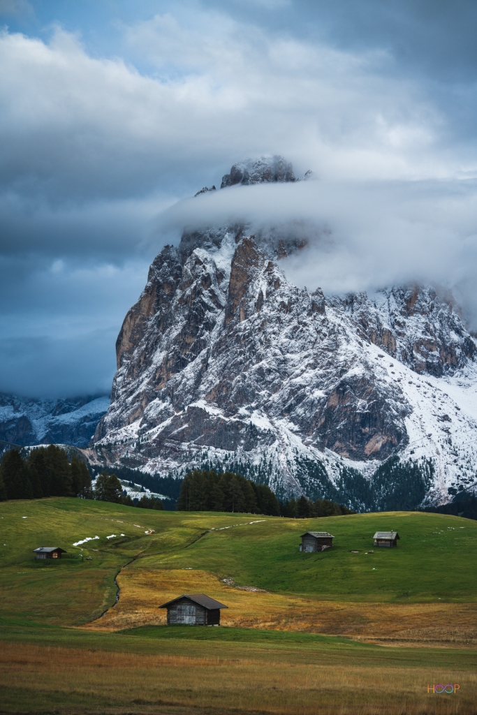 Small alpine huts at Seiser Alm plateau in Dolomites.